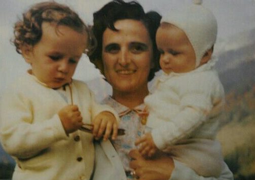 Photo of St. Gianna holding children in each arm